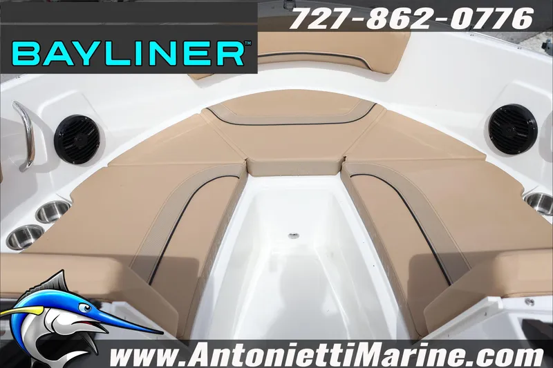 Slide: The Image of Bayliner V20 2026 boat interior with tan seating, cup holders, and speakers. - 13
