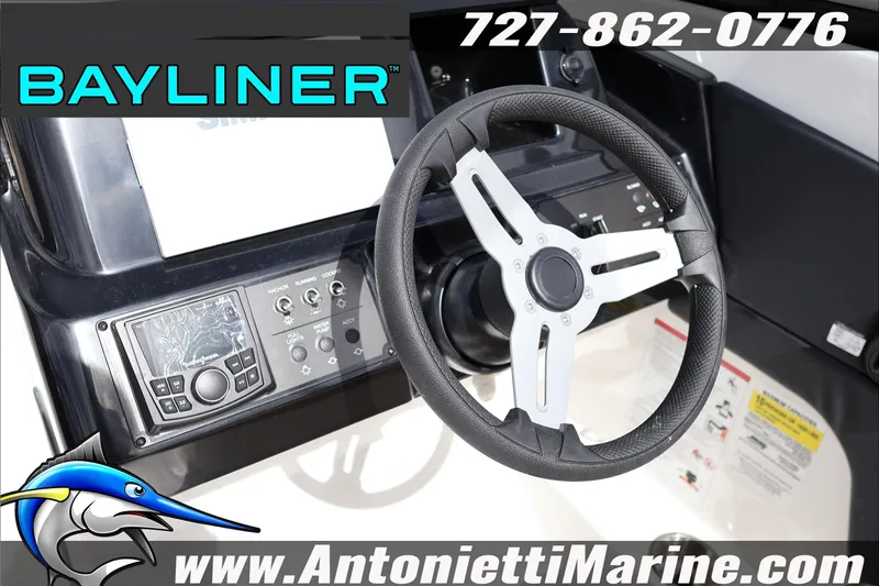 Slide: The Image of 2026 Bayliner V20 boat dashboard with steering wheel and control panel. - 18