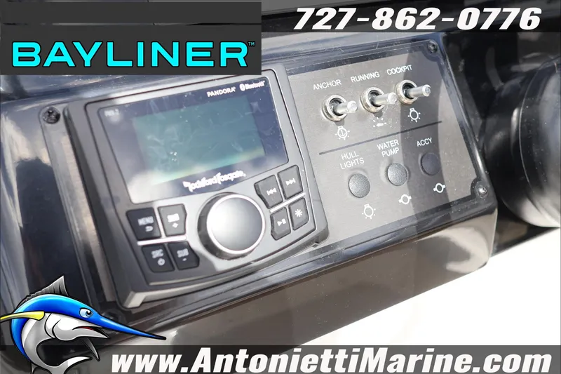 Slide: The Image of ```html
Alt text: "2026 Bayliner V20 control panel with switches and audio system."
``` - 19