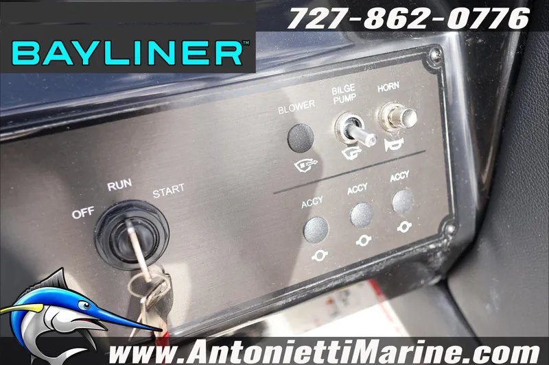 Slide: The Image of Control panel of a 2026 Bayliner V20 boat with ignition and switches. - 21