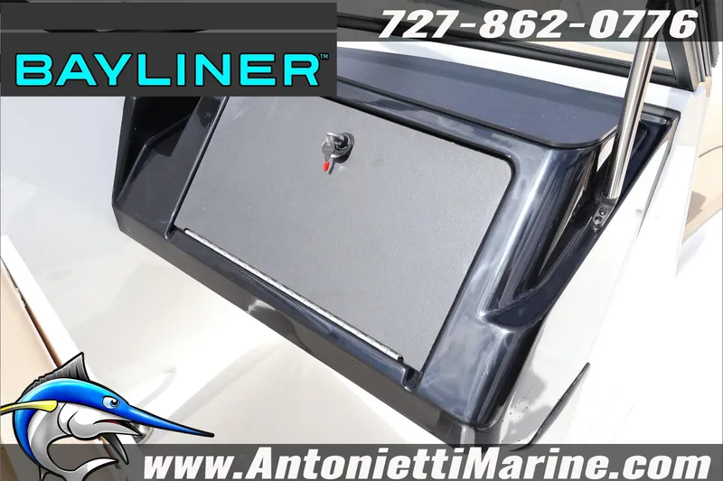 Slide: The Image of 2026 Bayliner V20 boat dashboard with storage compartment, Antonietti Marine branding. - 23