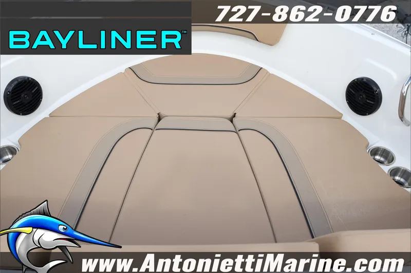 Slide: The Image of Bayliner V20 2026 boat interior with tan seating, speakers, and cup holders. - 26