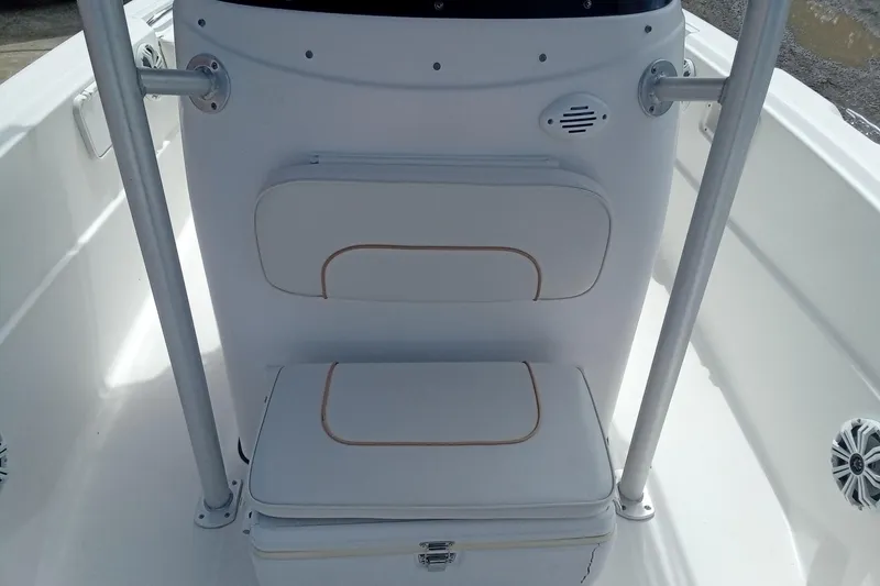 Slide: The Image of 2006 Wellcraft 232 Fisherman boat interior with white seating and storage. - 21