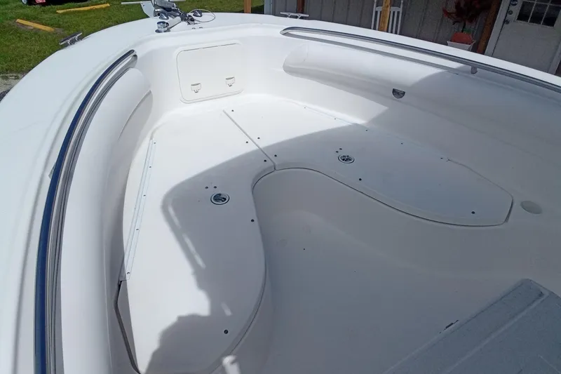 Slide: The Image of 2006 Wellcraft 232 Fisherman boat interior, featuring spacious deck and storage compartments. - 23
