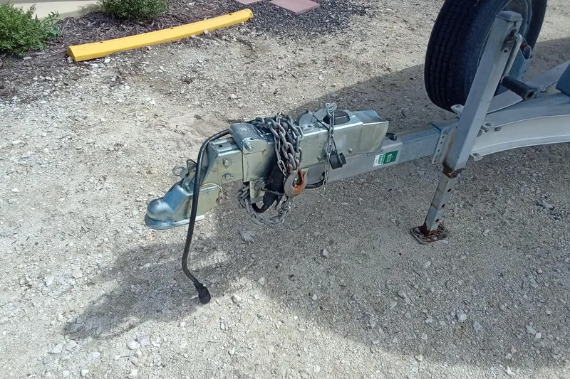 Slide: The Image of Trailer hitch of a 2006 Wellcraft 232 Fisherman boat, secured with chains. - 3