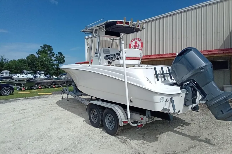 Slide: The Image of 2006 Wellcraft 232 Fisherman boat on trailer, parked outdoors near a building. - 8