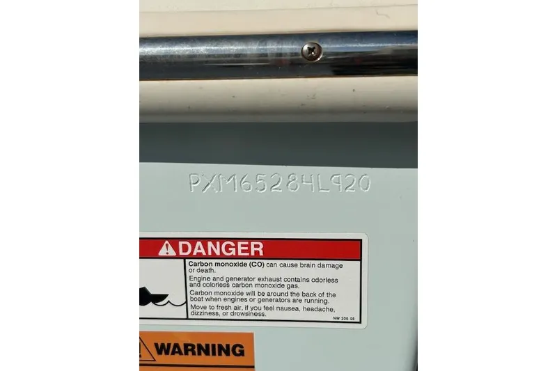 Slide: The Image of 2020 Parker 2520 XLD Sport Cabin boat with warning label and serial number. - 3