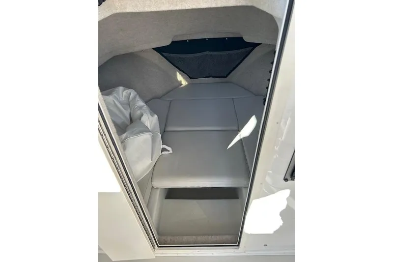 Slide: The Image of 2020 Parker 2520 XLD Sport Cabin interior with cushioned seating and storage space. - 5