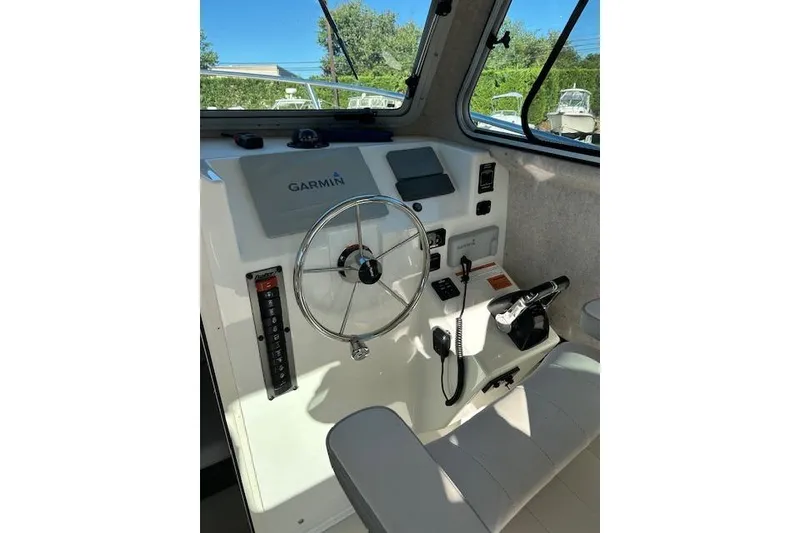 Slide: The Image of 2020 Parker 2520 XLD Sport Cabin helm with Garmin navigation system. - 7