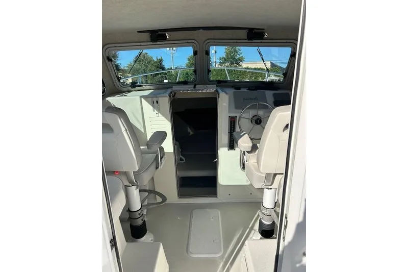 Slide: The Image of 2020 Parker 2520 XLD Sport Cabin interior with steering wheel and seating. - 8