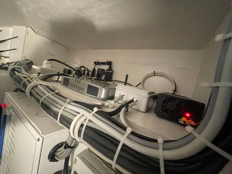 Slide: The Image of Electrical wiring and equipment inside a 2013 Hatteras GT63 yacht. - 27