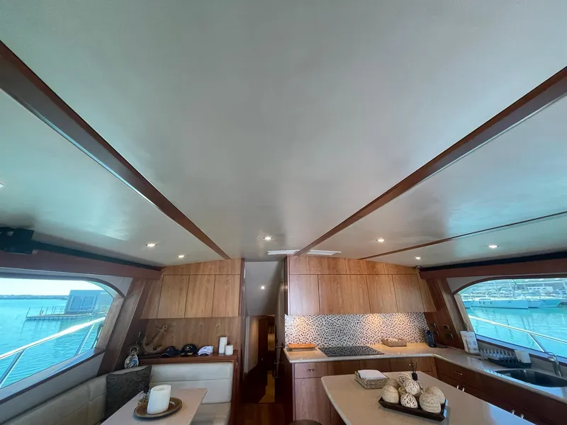 Slide: The Image of Luxurious interior of 2013 Hatteras GT63 yacht with modern kitchen and seating area. - 35