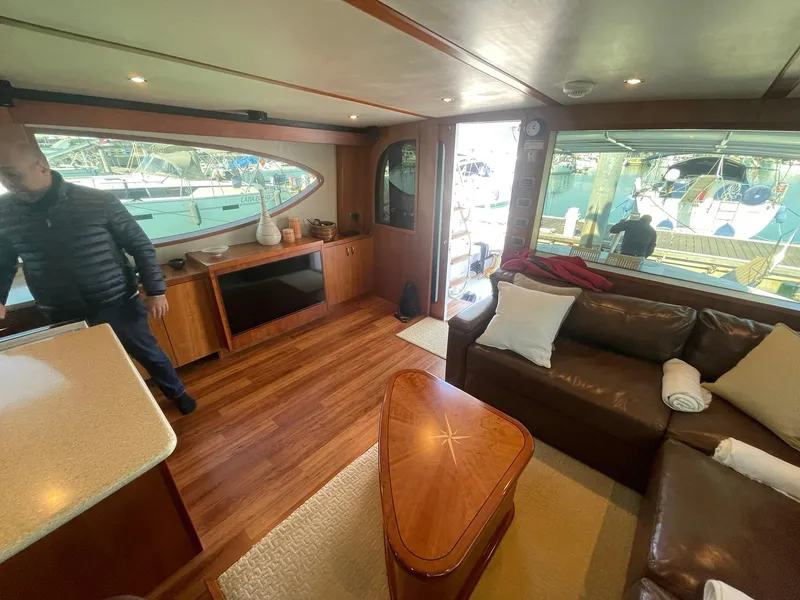 Slide: The Image of Luxurious interior of 2013 Hatteras GT63 yacht with leather seating and wooden finishes. - 39