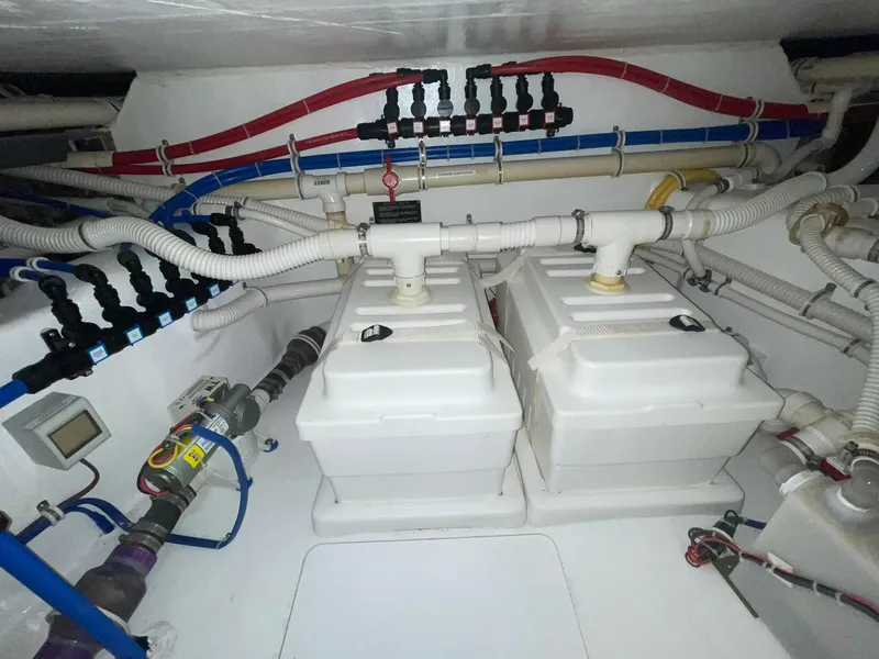 Slide: The Image of Engine room of 2013 Hatteras GT63 yacht with complex piping and equipment. - 8
