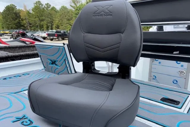 Slide: The Image of 2026 Xpress H22B Bay boat seat with logo, featuring sleek gray upholstery. - 10