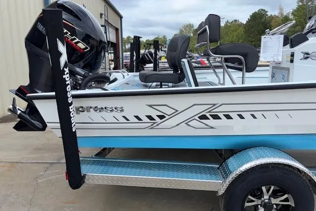 Slide: The Image of 2026 Xpress H22B Bay boat on trailer, featuring sleek design and powerful engine. - 12