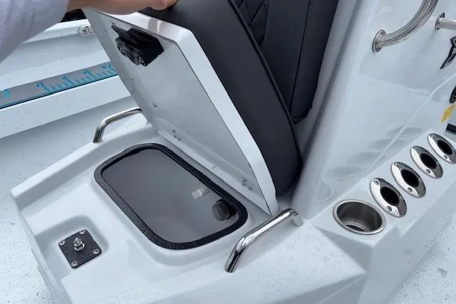 Slide: The Image of 2026 Xpress H22B Bay boat seat storage compartment with cup holders and sleek design. - 21