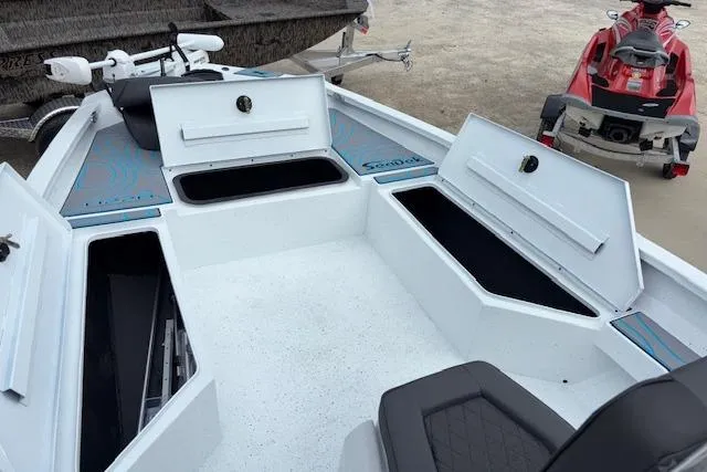 Slide: The Image of 2026 Xpress H22B Bay boat interior with open storage compartments and seating. - 24