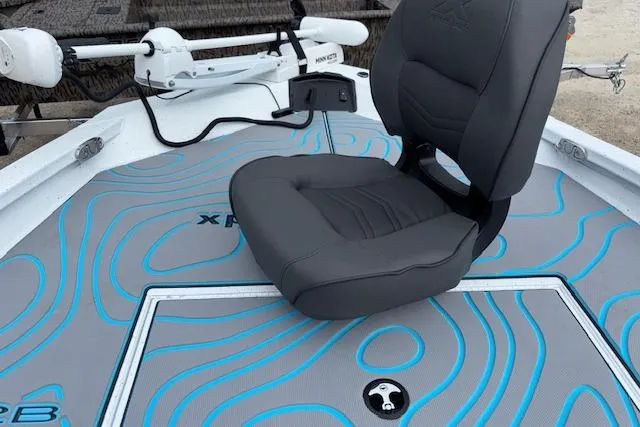 Slide: The Image of 2026 Xpress H22B Bay boat interior with gray seat and blue accents. - 25