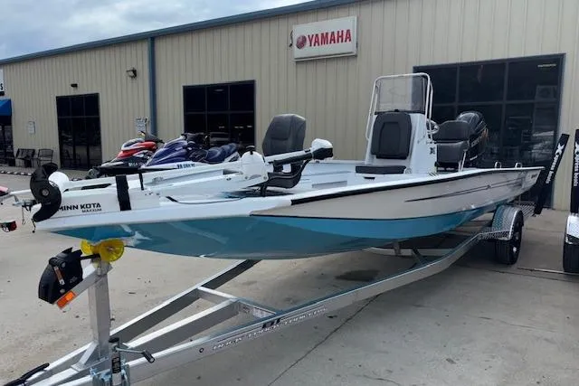 Slide: The Image of 2026 Xpress H22B Bay boat on trailer outside Yamaha dealership. - 4