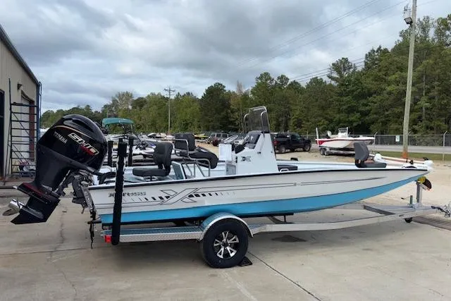 Slide: The Image of 2026 Xpress H22B Bay boat on trailer with Yamaha engine, parked outdoors. - 9