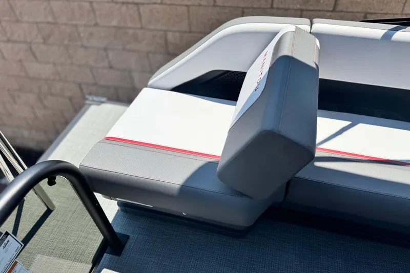 Slide: The Image of 2025 Manitou Cruise 20 boat seat with gray and white upholstery, red accent stitching. - 14