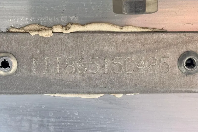 Slide: The Image of 2025 Manitou Cruise 20 serial number plate with engraved identification code. - 20