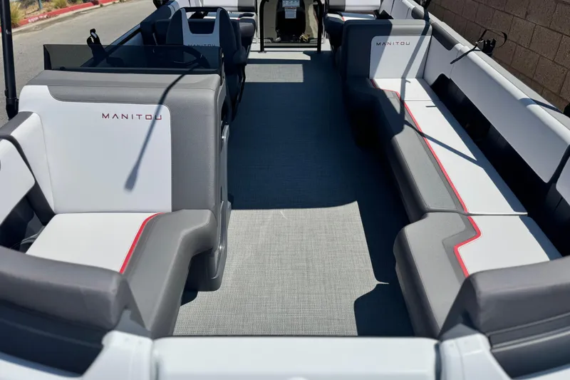 Slide: The Image of 2025 Manitou Cruise 20 pontoon boat interior with modern seating and sleek design. - 7
