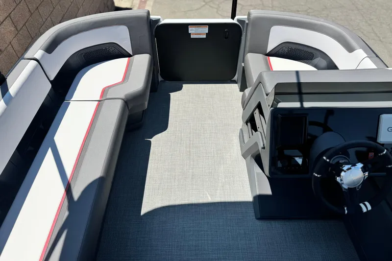 Slide: The Image of 2025 Manitou Cruise 20 interior with modern seating and steering console. - 8
