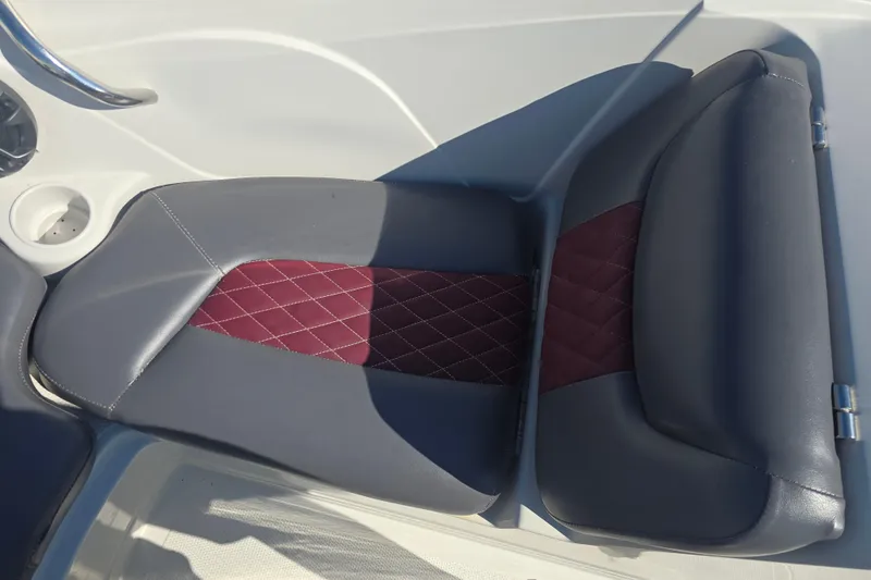 Slide: The Image of Gray and maroon seat on 2016 Tahoe 500 TS boat, featuring quilted design. - 11