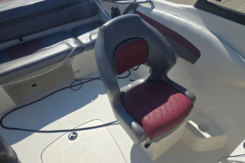 Slide: The Image of 2016 Tahoe 500 TS boat interior with maroon and gray seating. - 13