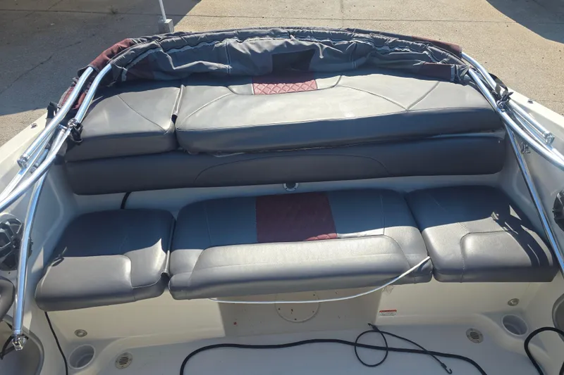Slide: The Image of 2016 Tahoe 500 TS boat interior with cushioned seating and storage area. - 14