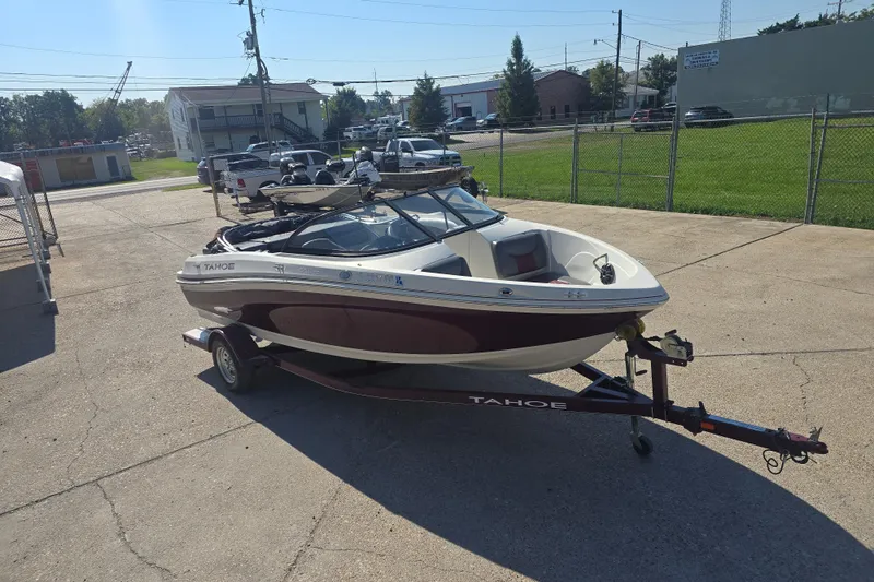 Slide: The Image of 2016 Tahoe 500 TS boat on trailer in parking lot, sunny day. - 4