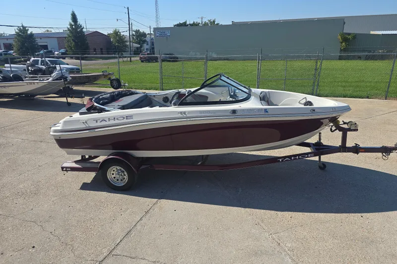 Slide: The Image of 2016 Tahoe 500 TS boat on trailer, parked outdoors in a lot. - 5