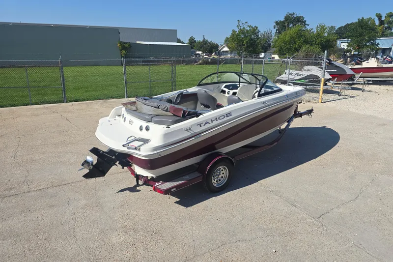 Slide: The Image of 2016 Tahoe 500 TS boat on trailer in outdoor storage area. - 6