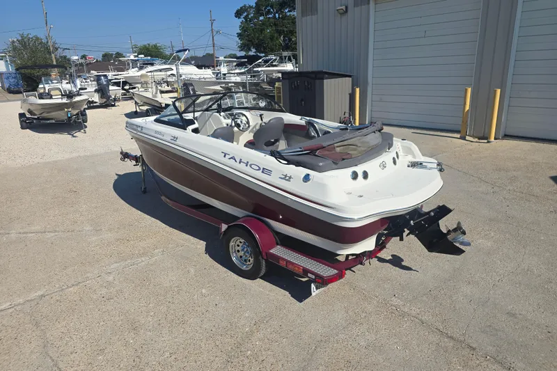 Slide: The Image of 2016 Tahoe 500 TS boat on trailer in marina parking lot. - 8