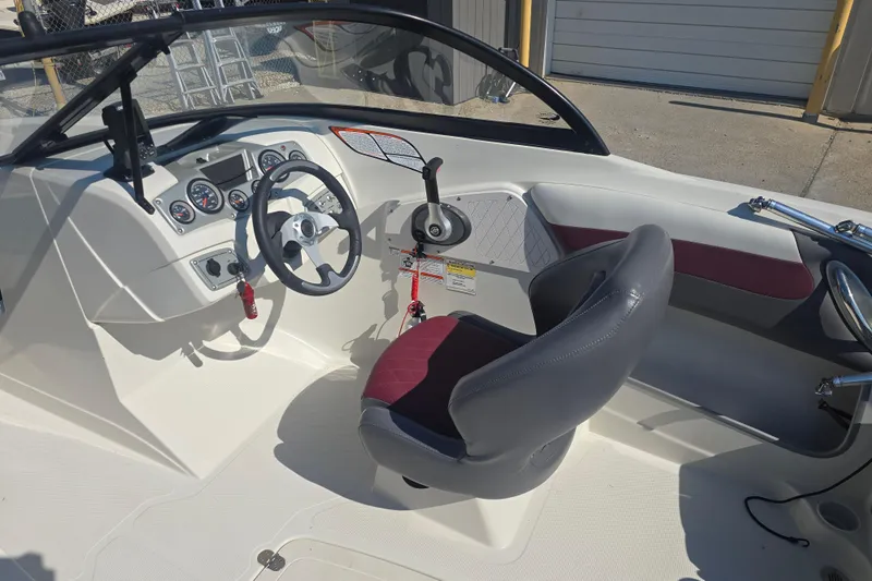 Slide: The Image of 2016 Tahoe 500 TS boat interior with steering wheel and dashboard controls. - 9