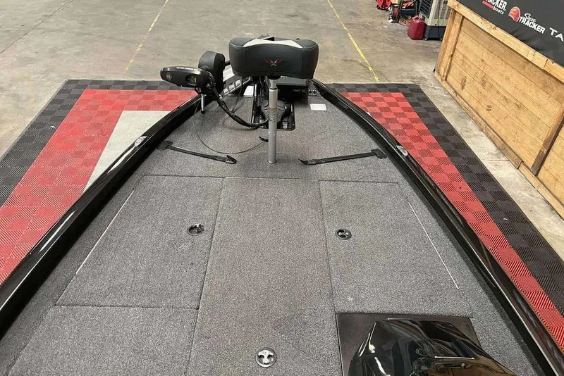 Slide: The Image of 2020 Vexus AVX1880 boat deck with trolling motor in a garage setting. - 7