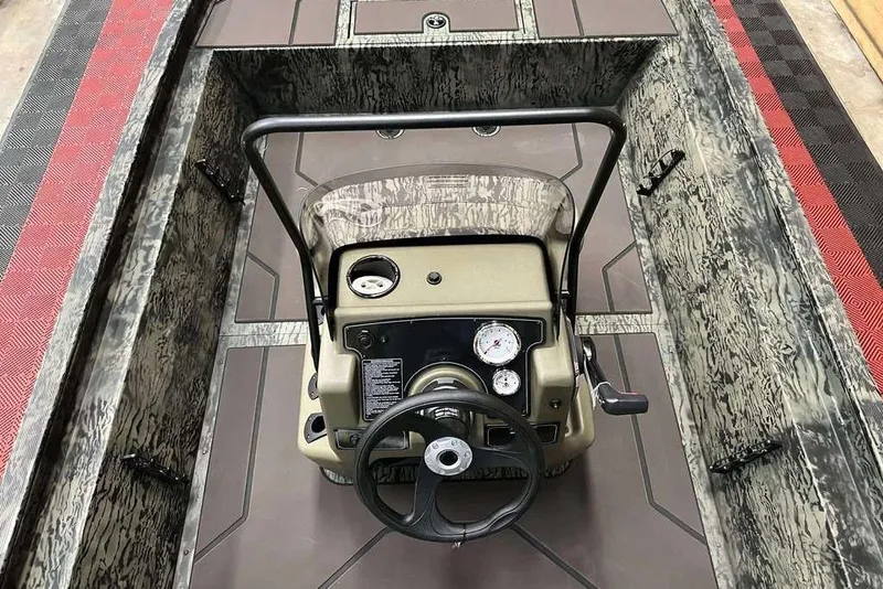 Slide: The Image of 2026 Tracker Grizzly 1860 CC boat console with steering wheel and gauges. - 5