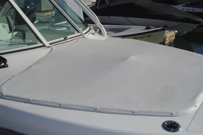 Slide: The Image of 2024 Albemarle 27 Dual Console boat with covered bow at marina. - 10