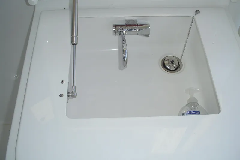 Slide: The Image of 2024 Albemarle 27 Dual Console sink with chrome faucet and soap dispenser. - 19