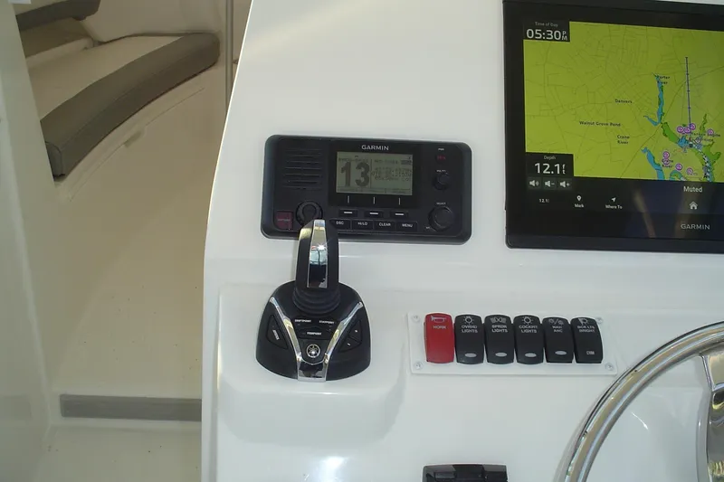 Slide: The Image of 2024 Albemarle 27 Dual Console dashboard with Garmin navigation and control panel. - 25