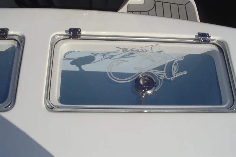 Slide: The Image of 2024 Albemarle 27 Dual Console boat window with etched fish design. - 43