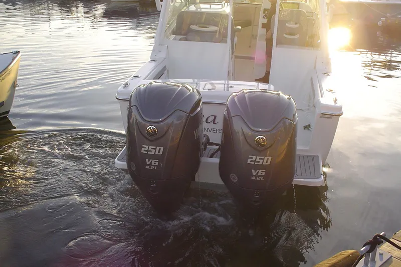 Slide: The Image of 2024 Albemarle 27 Dual Console with twin 250 V6 engines at sunset on water. - 8