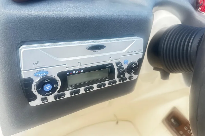 Slide: The Image of Jensen stereo system on 2011 Godfrey Aqua Patio 240 Pontoon dashboard. - 10