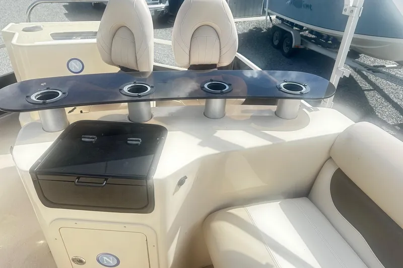 Slide: The Image of 2011 Godfrey Aqua Patio 240 Pontoon interior with seating and cup holders. - 16