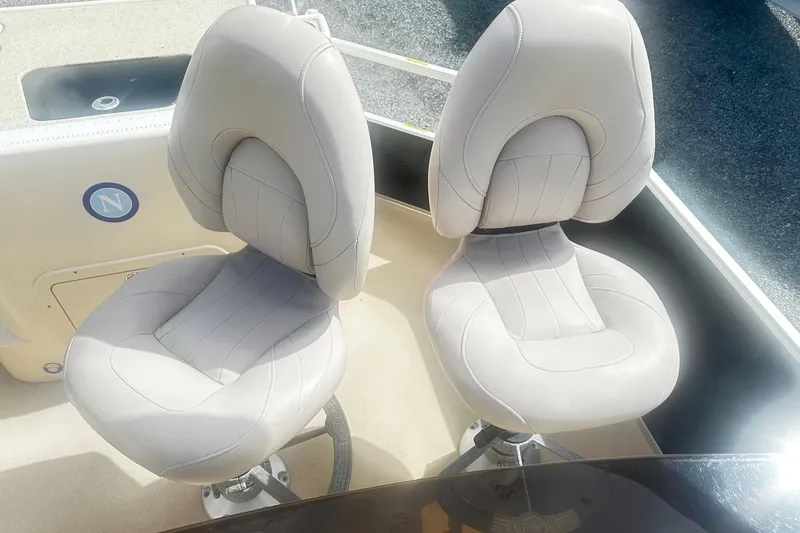 Slide: The Image of Two comfortable seats on a 2011 Godfrey Aqua Patio 240 Pontoon boat. - 17