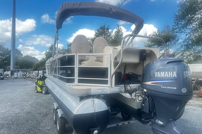 Slide: The Image of 2011 Godfrey Aqua Patio 240 Pontoon with Yamaha outboard motor on trailer. - 3