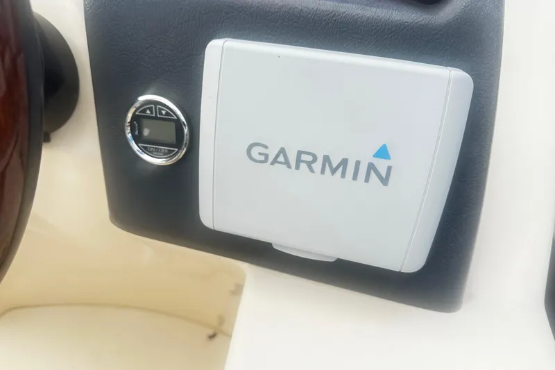 Slide: The Image of Garmin device on 2011 Godfrey Aqua Patio 240 Pontoon dashboard. - 9