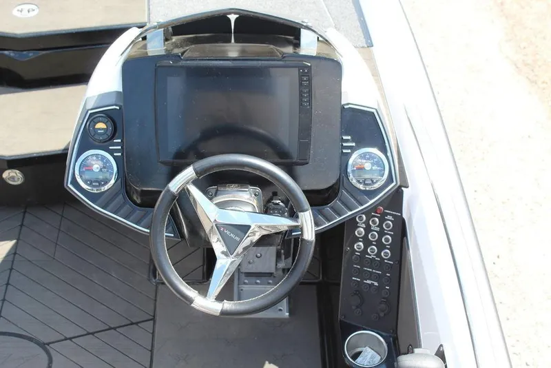 Slide: The Image of 2021 Vexus VX20 boat dashboard with steering wheel and digital display. - 13